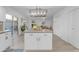 Open-concept kitchen features a central island and is open to living and patio spaces at 1917 E Karen Dr, Phoenix, AZ 85022