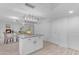 Kitchen with island open to dining room and fireplace at 1917 E Karen Dr, Phoenix, AZ 85022