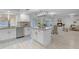 This bright kitchen features an island with seating and is open to the Gathering room at 1917 E Karen Dr, Phoenix, AZ 85022