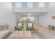 Open-concept living space with light wood floors and dining room in the background at 1917 E Karen Dr, Phoenix, AZ 85022