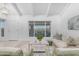 Bright living room featuring beamed ceilings, light wood floors and large windows with city views at 1917 E Karen Dr, Phoenix, AZ 85022