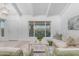Bright living room featuring beamed ceilings, light wood floors and large windows with city views at 1917 E Karen Dr, Phoenix, AZ 85022