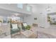 Bright living room featuring wood flooring, white walls, and two armchairs at 1917 E Karen Dr, Phoenix, AZ 85022