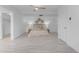 Spacious primary bedroom offers tile flooring with decorative wall art and bright light fixtures at 1917 E Karen Dr, Phoenix, AZ 85022