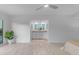 Spacious primary bedroom with wood-look tile flooring leading to ensuite bathroom at 1917 E Karen Dr, Phoenix, AZ 85022