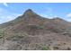 A scenic view of a desert mountain under a clear blue sky, with hiking trails visible at 1917 E Karen Dr, Phoenix, AZ 85022