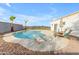 Outdoor pool with diving board, desert landscaping and sunny skies creates a tranquil backyard oasis at 1917 E Karen Dr, Phoenix, AZ 85022