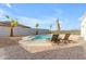 Stunning pool featuring lounge chairs, an umbrella, palm trees and a scenic mountain backdrop at 1917 E Karen Dr, Phoenix, AZ 85022
