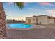 Private pool area with desert landscaping, palm trees, and comfortable lounge chairs at 1917 E Karen Dr, Phoenix, AZ 85022