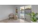 Bright room with chair, table and a view of the pool area through sliding glass doors at 1917 E Karen Dr, Phoenix, AZ 85022