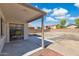 Backyard with covered patio, block wall fence, and blank landscape canvas to add your personal touch at 2112 S 160Th Dr, Goodyear, AZ 85338