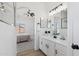 Bright bathroom showcasing white vanity with black hardware and featuring a view of the main bedroom at 2112 S 160Th Dr, Goodyear, AZ 85338