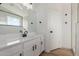 Bathroom showcasing white cabinets, a framed mirror, and modern fixtures for a luxurious feel at 2112 S 160Th Dr, Goodyear, AZ 85338