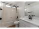 Clean bathroom featuring a shower-tub combo, modern faucet, and natural light at 2112 S 160Th Dr, Goodyear, AZ 85338