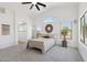 Spacious bedroom with high ceilings, plush carpeting, and abundant natural light at 2112 S 160Th Dr, Goodyear, AZ 85338
