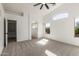 Spacious bedroom featuring carpet, a ceiling fan, and an adjoining closet for ample storage space at 2112 S 160Th Dr, Goodyear, AZ 85338