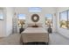 Serene bedroom with neutral tones, stylish decor, and plenty of natural light from the windows at 2112 S 160Th Dr, Goodyear, AZ 85338