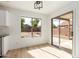 Bright dining area with sliding glass doors and view of the backyard and patio at 2112 S 160Th Dr, Goodyear, AZ 85338