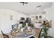 Well-lit kitchen featuring stainless steel appliances, granite countertops, and a dining table with four chairs at 2112 S 160Th Dr, Goodyear, AZ 85338