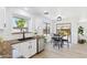Charming kitchen area with bright light over the sink and a view to a table for four at 2112 S 160Th Dr, Goodyear, AZ 85338