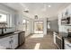 Open concept kitchen with stainless steel appliances and sliding glass doors to the backyard at 2112 S 160Th Dr, Goodyear, AZ 85338