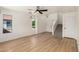 Open living room with wood floors, bright windows, and staircase to the second floor at 2112 S 160Th Dr, Goodyear, AZ 85338