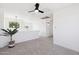 Bright loft with neutral carpet, recessed lighting, and windows overlooking the exterior at 2112 S 160Th Dr, Goodyear, AZ 85338