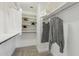 Well-organized walk-in closet with built-in shelving and ample storage for clothing and accessories at 2112 S 160Th Dr, Goodyear, AZ 85338