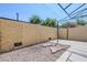 View of a low-maintenance backyard featuring a rock garden and a covered patio at 2223 E Catalina Dr, Phoenix, AZ 85016