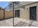 Enclosed backyard with covered patio area and security doors and windows at 2223 E Catalina Dr, Phoenix, AZ 85016