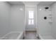 Bright bathroom showcasing tiled shower with showerhead and separate bathtub at 2223 E Catalina Dr, Phoenix, AZ 85016