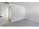 Neutral bedroom featuring carpet, closet, and access to the rest of the home at 2223 E Catalina Dr, Phoenix, AZ 85016