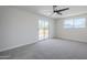 Well-lit bedroom featuring a sliding glass door and additional window for ample natural light at 2223 E Catalina Dr, Phoenix, AZ 85016