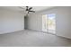 Bright bedroom featuring sliding glass door to a private patio at 2223 E Catalina Dr, Phoenix, AZ 85016