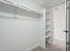 Walk-in closet with built in shelves and hanging storage at 2223 E Catalina Dr, Phoenix, AZ 85016