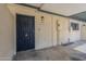 The entrance features a secured door and classic lighting with a security door at 2223 E Catalina Dr, Phoenix, AZ 85016
