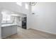Bright kitchen features stainless appliances, gray cabinets, and a spacious island, enhancing modern appeal at 2223 E Catalina Dr, Phoenix, AZ 85016