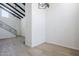 The living room features vaulted ceilings and new hardwood floors with an open stairway to the upper floor at 2223 E Catalina Dr, Phoenix, AZ 85016