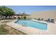 Enjoy the community pool with lounge seating and a serene setting at 2223 E Catalina Dr, Phoenix, AZ 85016