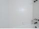 Recently remodeled shower with tiled walls, updated shower head and fixtures at 2223 E Catalina Dr, Phoenix, AZ 85016