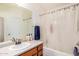 A bathroom featuring a sink and vanity with a shower-tub combination at 22670 N Kennedy Dr, Maricopa, AZ 85138