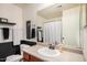 Bathroom features a sink and vanity with a shower-tub combination and painted walls at 22670 N Kennedy Dr, Maricopa, AZ 85138