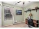 Bedroom with a window and a desk with traditional-style decor at 22670 N Kennedy Dr, Maricopa, AZ 85138