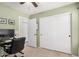 Bedroom featuring a writing desk, closet, neutral decor and a ceiling fan at 22670 N Kennedy Dr, Maricopa, AZ 85138