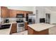 Bright kitchen features stainless steel appliances and a kitchen island at 22670 N Kennedy Dr, Maricopa, AZ 85138
