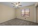 Bedroom features neutral carpeting and a large window with natural light at 2455 E Broadway Rd # 122, Mesa, AZ 85204