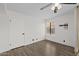 Clean bedroom with wood-look floors, a ceiling fan, a large closet, and a window for natural light at 2455 E Broadway Rd # 122, Mesa, AZ 85204