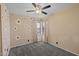 Bedroom features wallpaper with a flower pattern and a large window with natural light at 2455 E Broadway Rd # 122, Mesa, AZ 85204