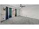 Spacious bedroom features a ceiling fan and neutral carpeting for a cozy atmosphere at 2455 E Broadway Rd # 122, Mesa, AZ 85204