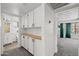 Hallway includes built-in cabinets and a butcher block countertop, with access to the bathroom at 2455 E Broadway Rd # 122, Mesa, AZ 85204
